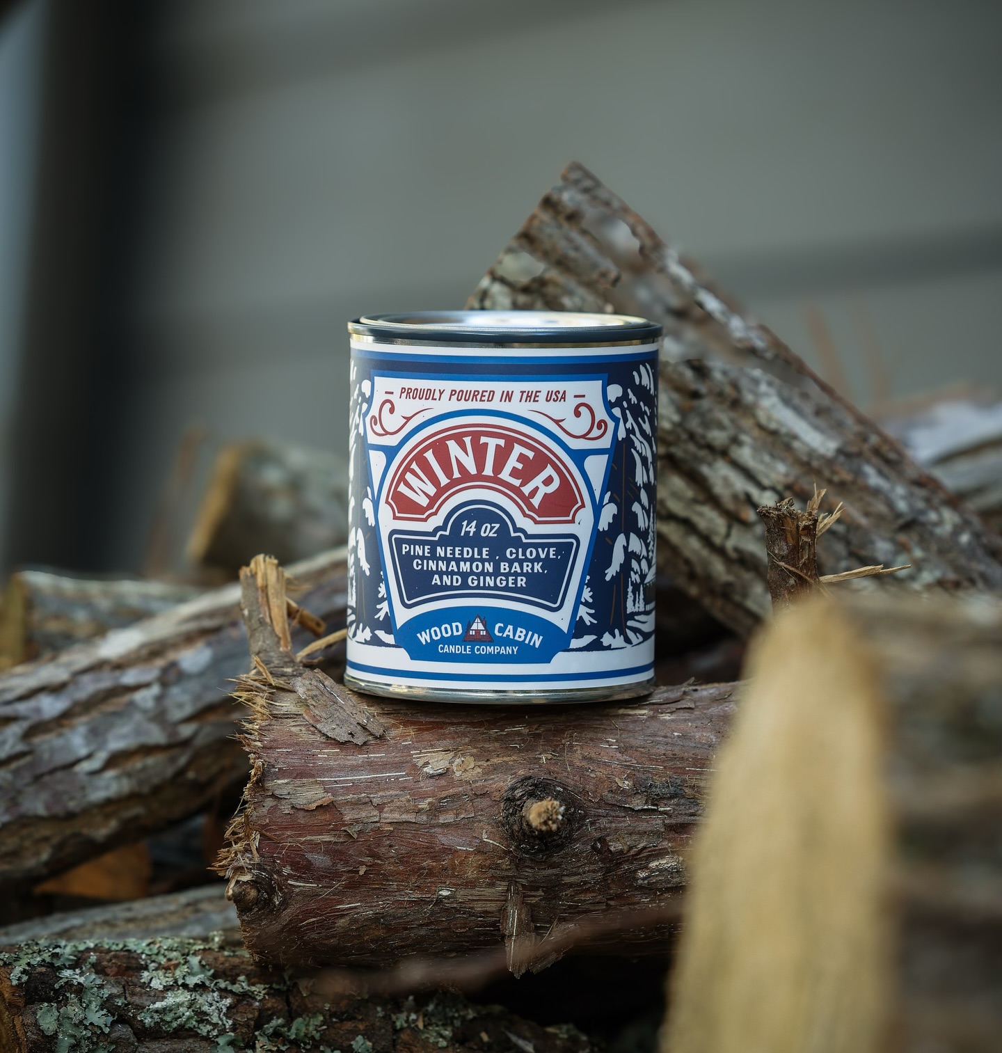Wood Cabin Candle Company Facebook ad: Refreshing pine needle, spiced clove, and rich cinnamon…