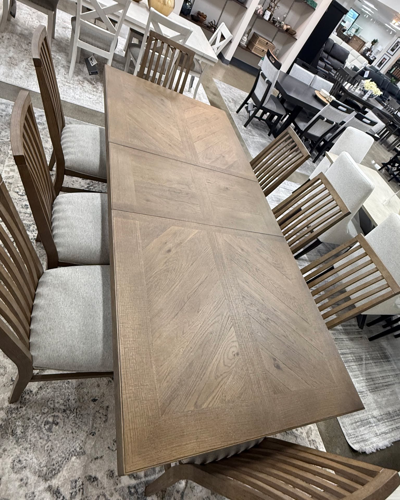 Jaime Hansen Facebook ad: Herringbone Top Extendable 9-Piece Dining Set, Table & 8…