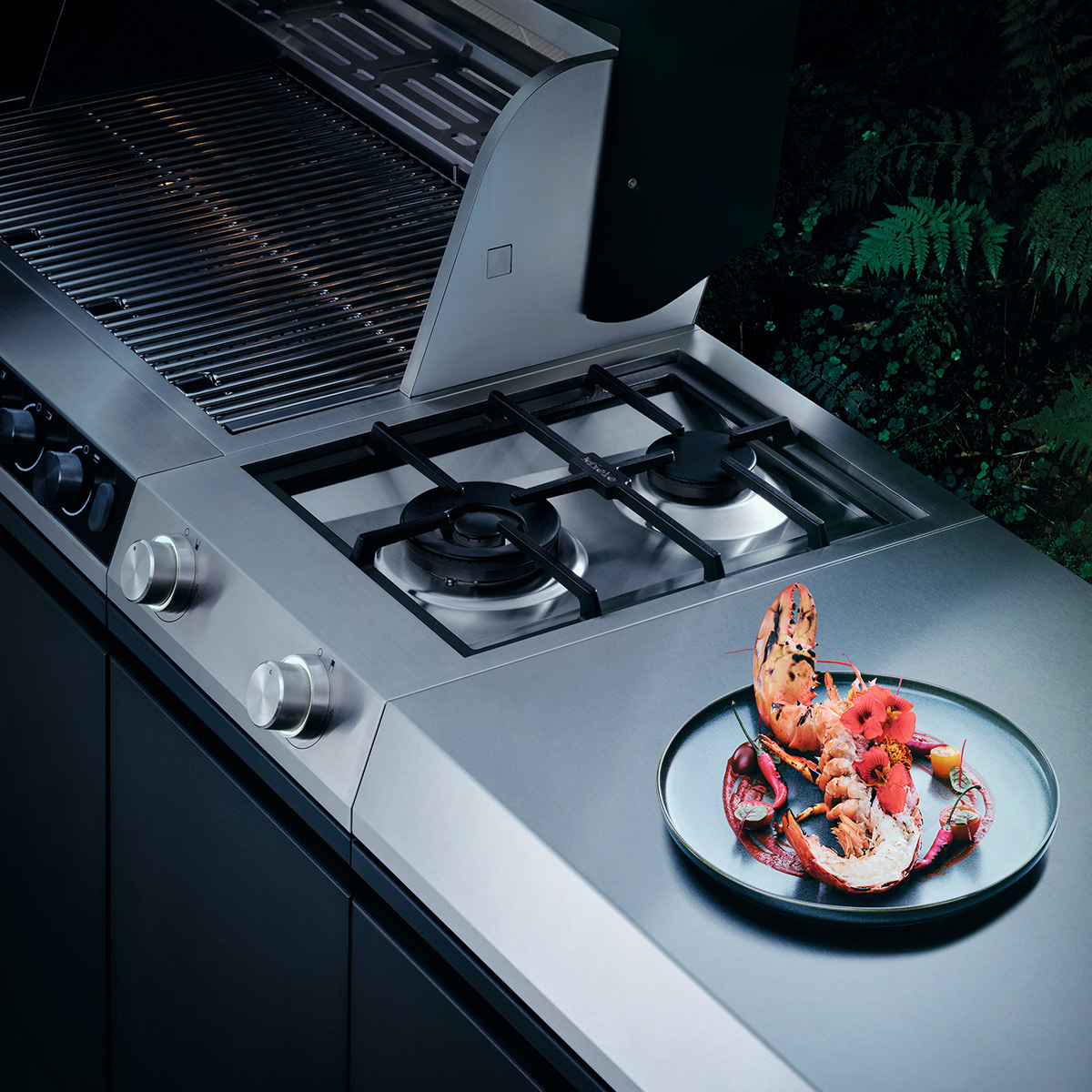 Miele Facebook ad: Die Evolution des draußen Kochens.