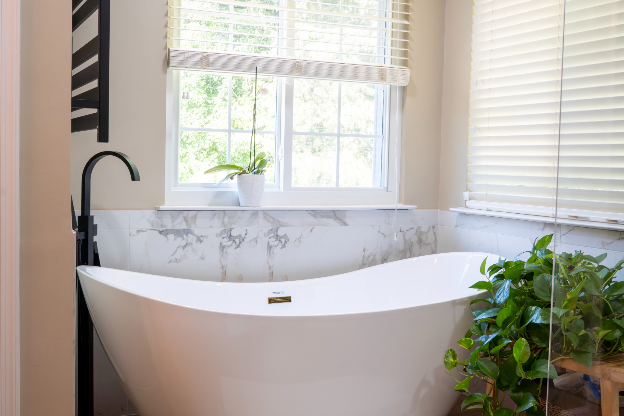 MJK Improvements Facebook ad: Your bathroom should feel peaceful, functional, and…
