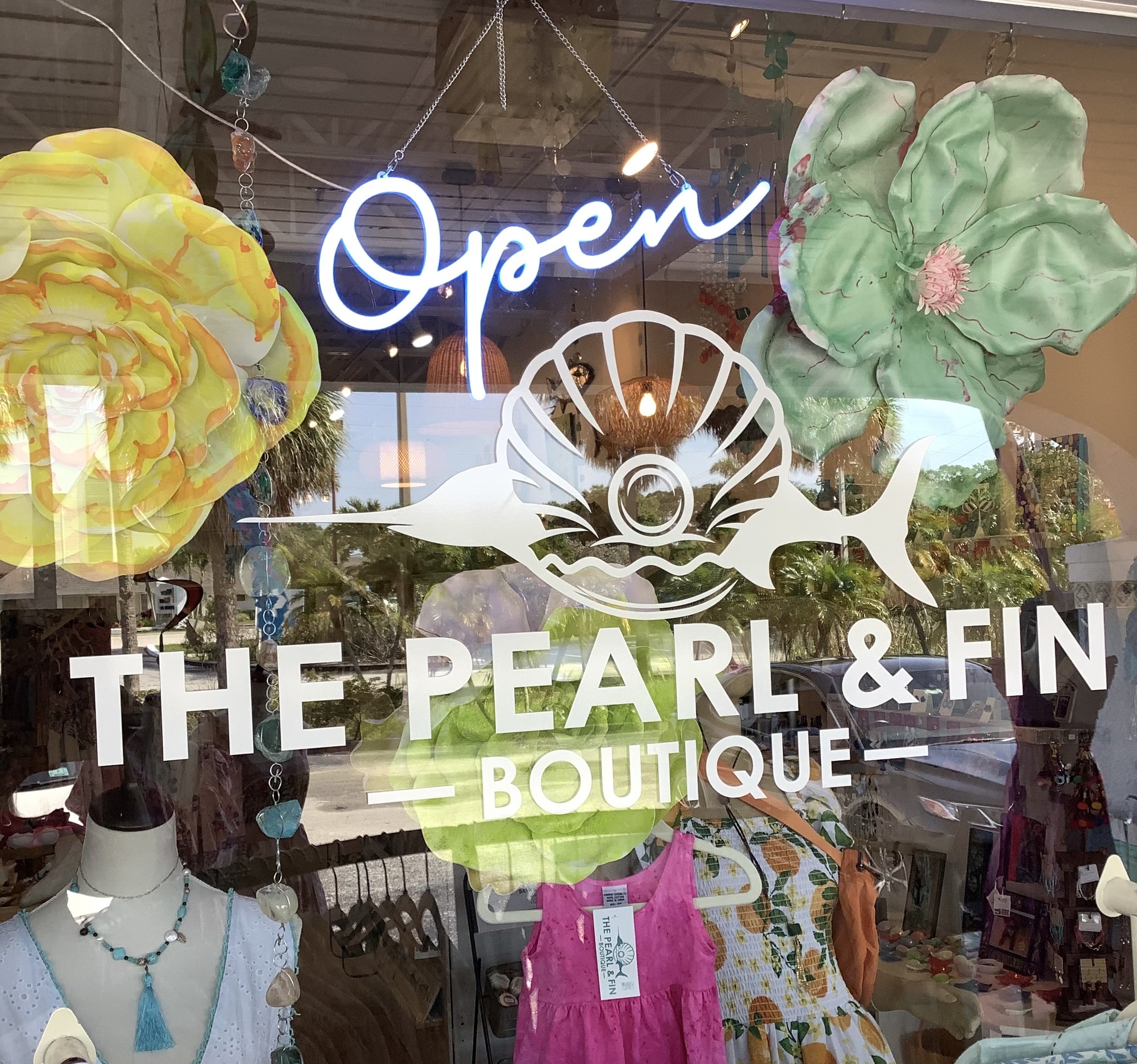 The Pearl & Fin Boutique Facebook ad: Nestled in the Cedar Point Plaza, this boutique…