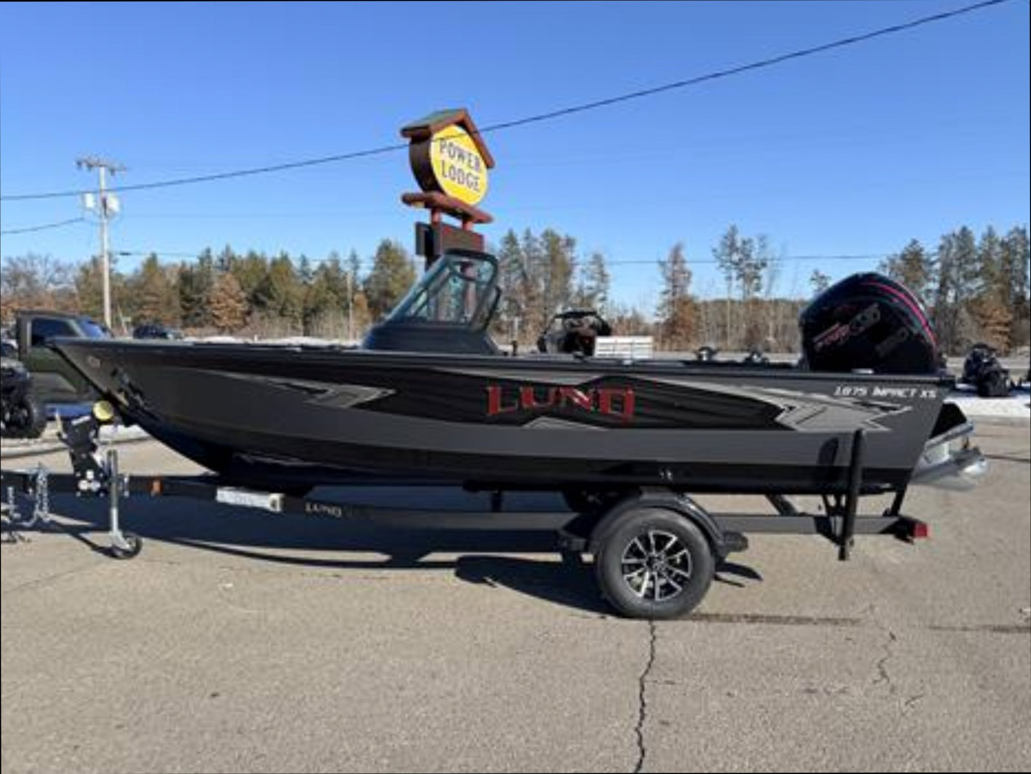Power Lodge Facebook ad: 2026 LUND 1875 IMPACT XS **FREE $500 SIMMS FISHING GEAR**
