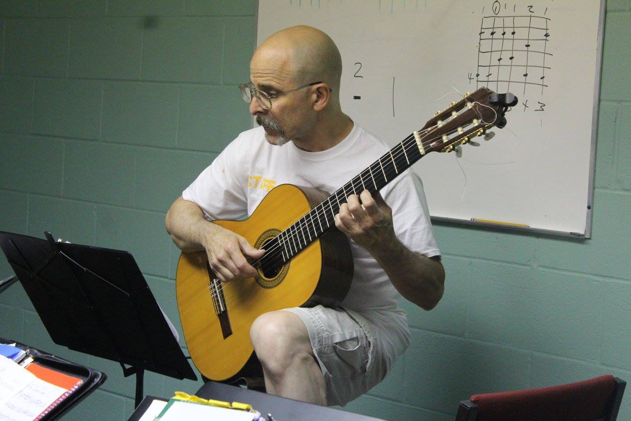 Music with Mr. Browne Facebook ad: FREE Guitar Class For Adults, Onliine