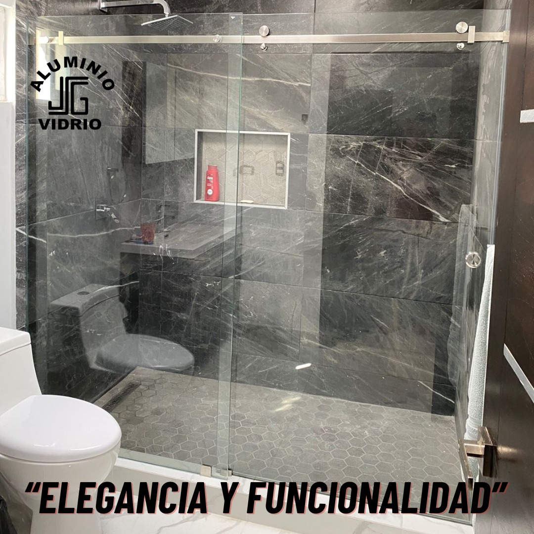 Aluminios y Vidrios AMSES Facebook ad: ¡Renueva tu baño con estilo y funcionalidad!
