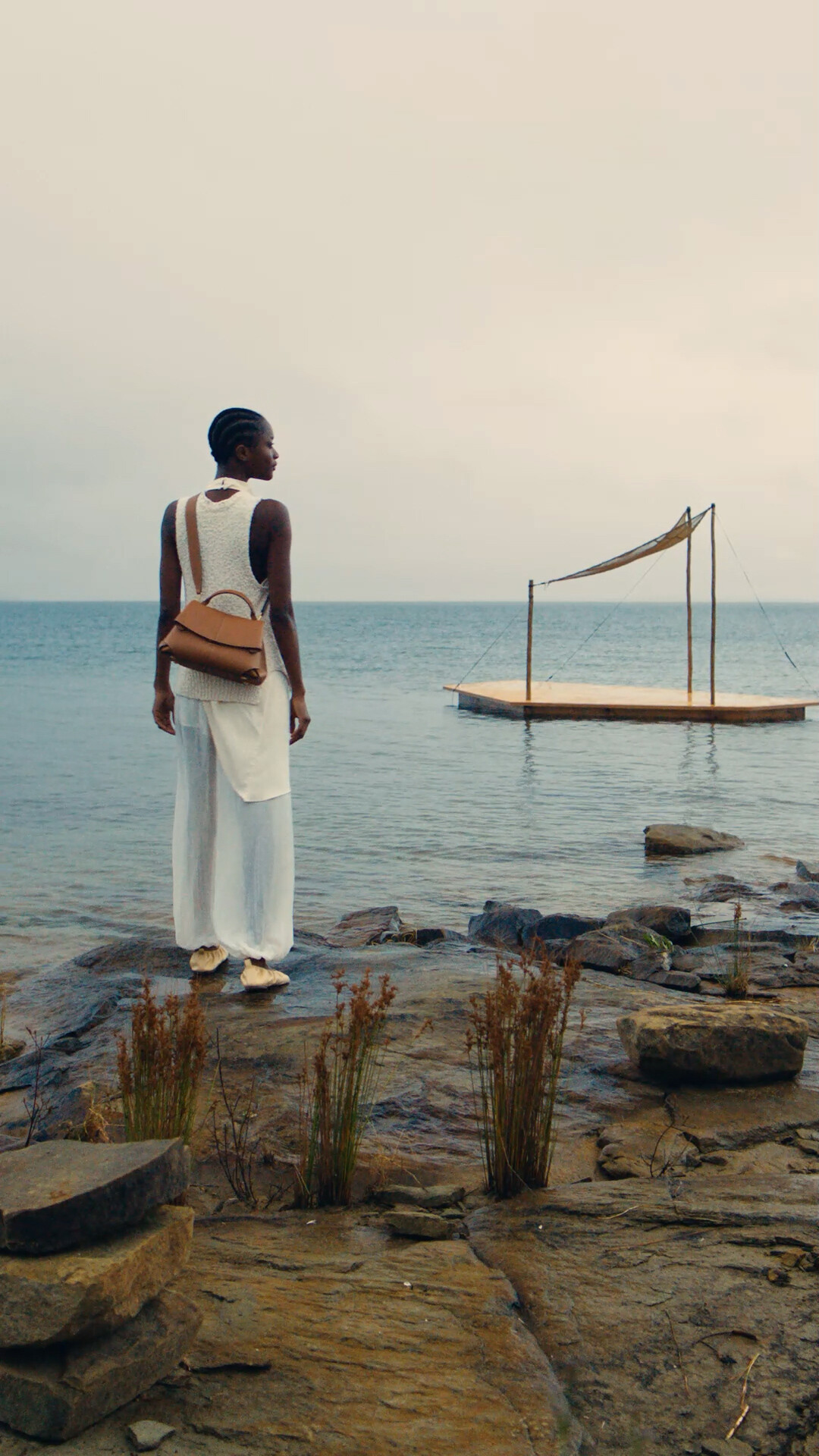 Polène Facebook ad: The Passenger of the Lake drifts through still…