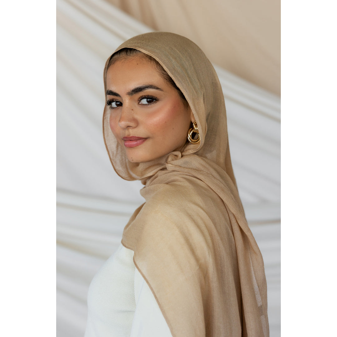 Vela Facebook ad: At VELA, we create timeless, high-quality scarves with…