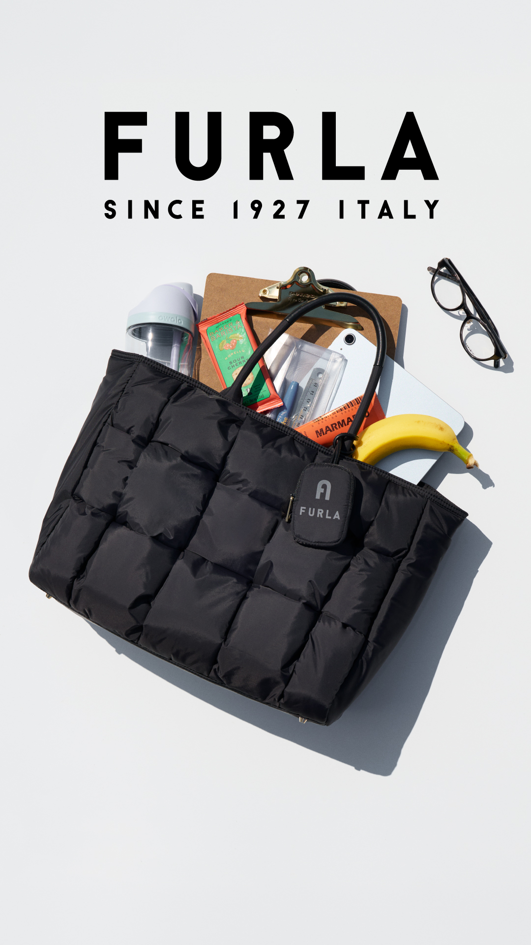Furla Facebook ad: 撥水性のナイロン仕様で、雨にも強くかつ軽量なバッグ「OPPORTUNITY(オポチュニティ)」。毎日を忙しく過ごす女性…