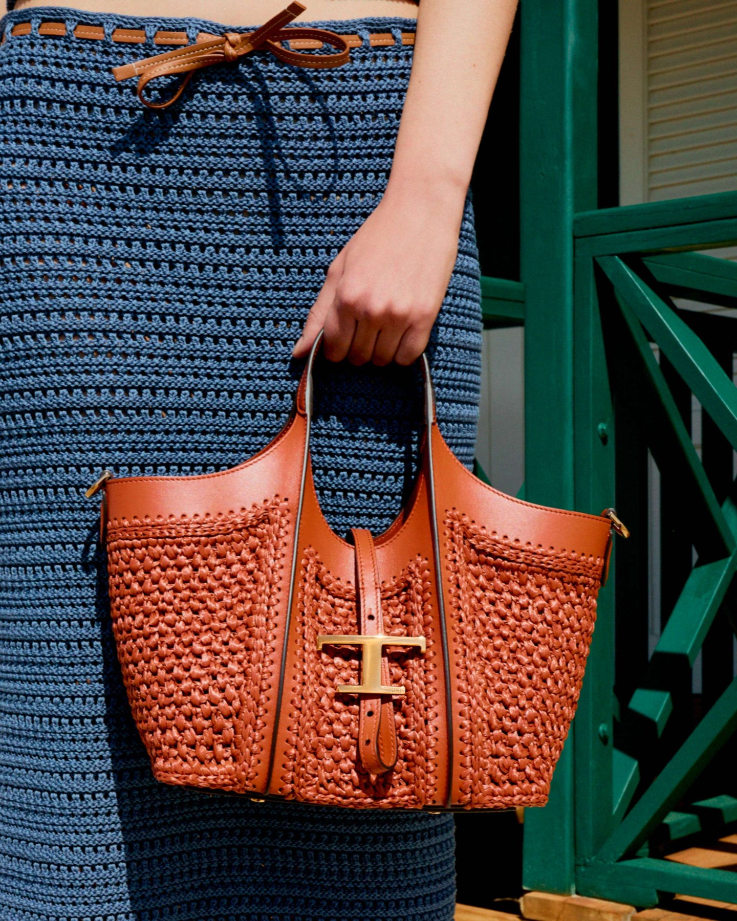 Tod's Facebook ad: Summer textures: rafia and crochet capture a lighter…