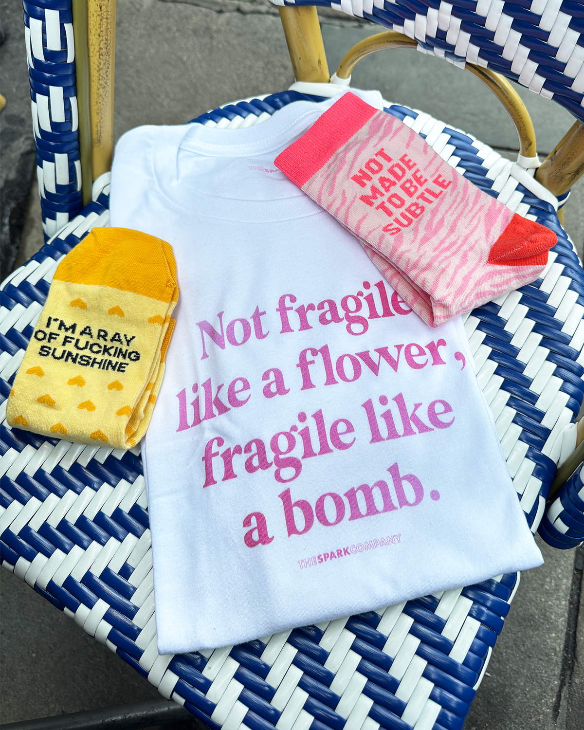 The Spark Company Facebook ad: Every Purchase Helps A Woman In Need