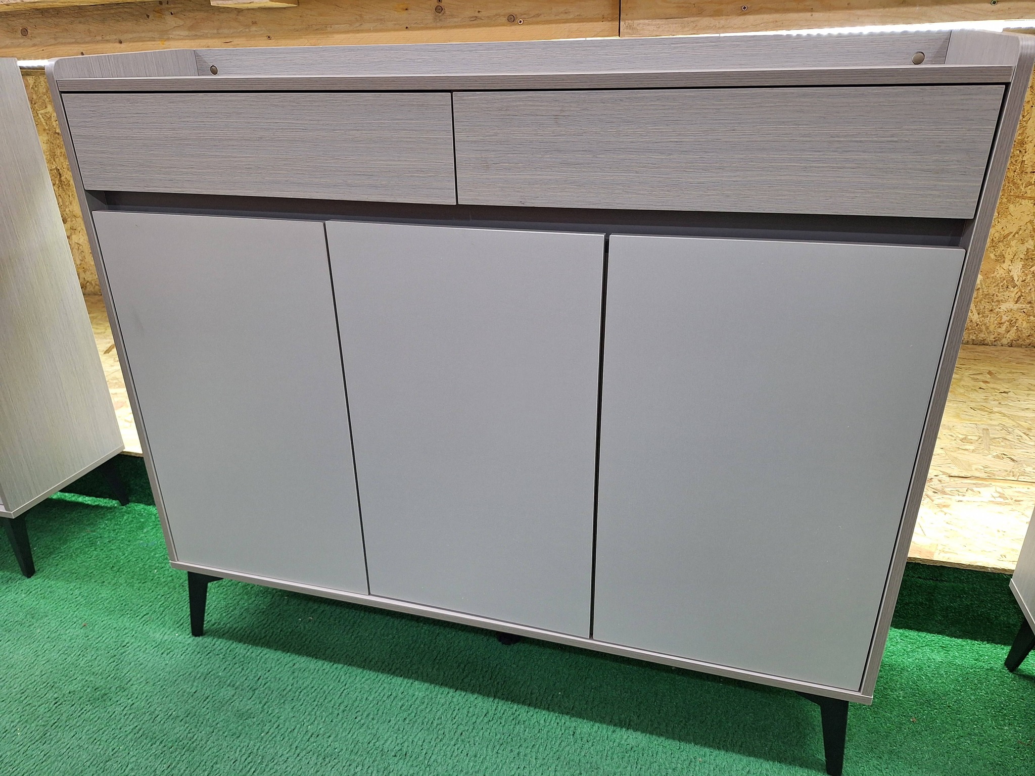Maya's modern art Facebook ad: Wooden sideboards and metal consoles on offer.