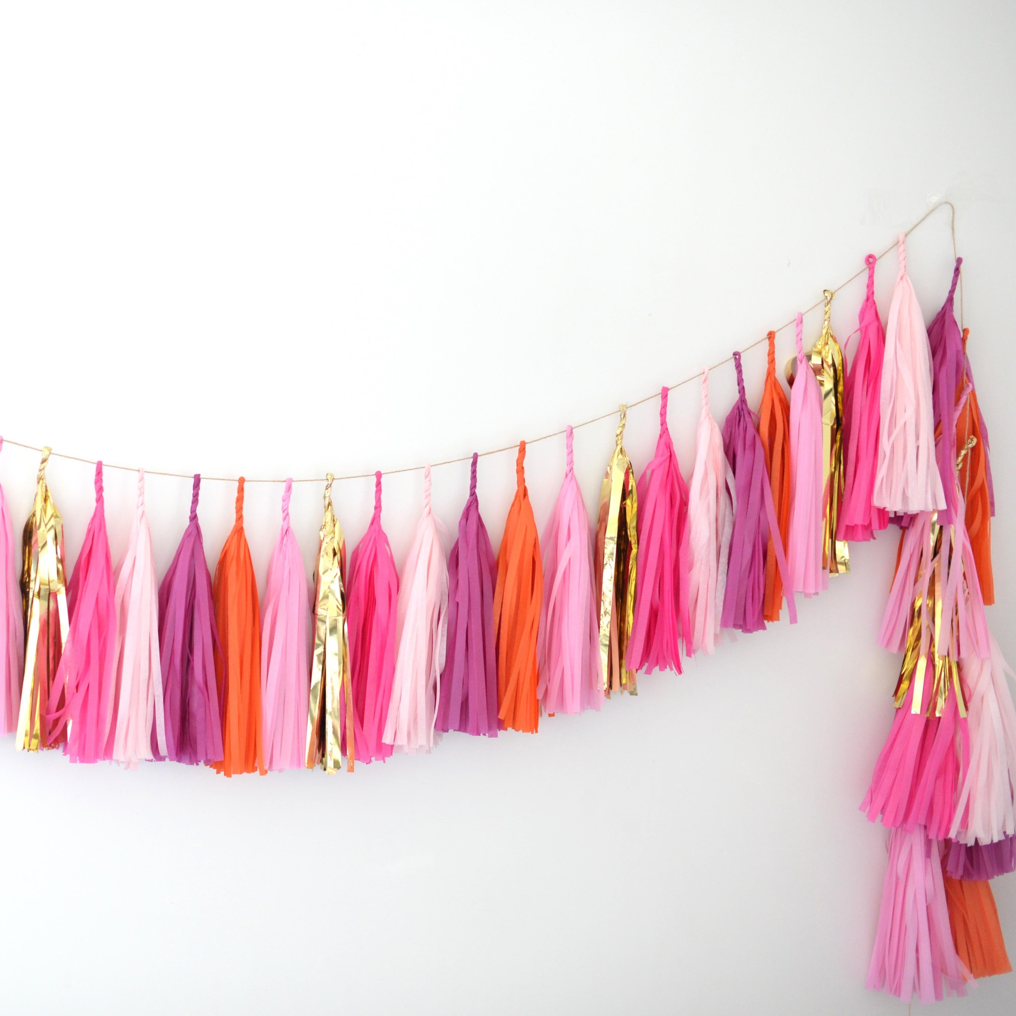 Deco Pompoms Facebook ad: Orange Sherbet, Pink and Gold Paper Tassel Garland |…