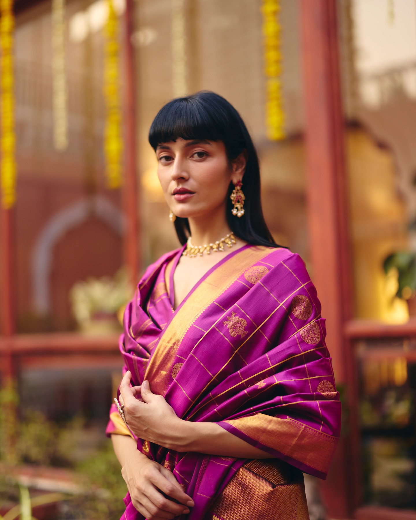 Athyeka Heritage Facebook ad: Checks of gold on royal magenta.