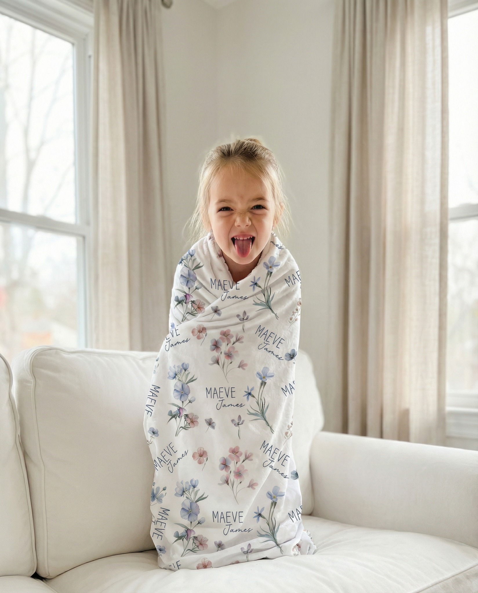 Prettybirds Facebook ad: Her Name + Wildflowers = The Blanket She Takes Everywhere