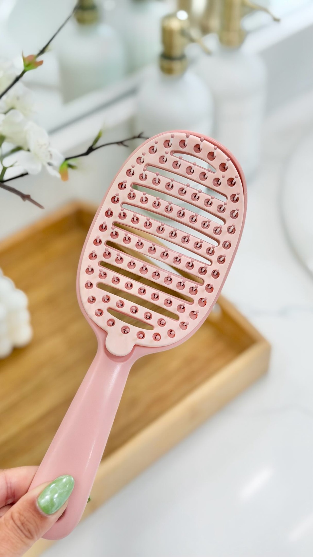 Everything Envy Facebook ad: A multi-tasking hairbrush because you’re booked and busy