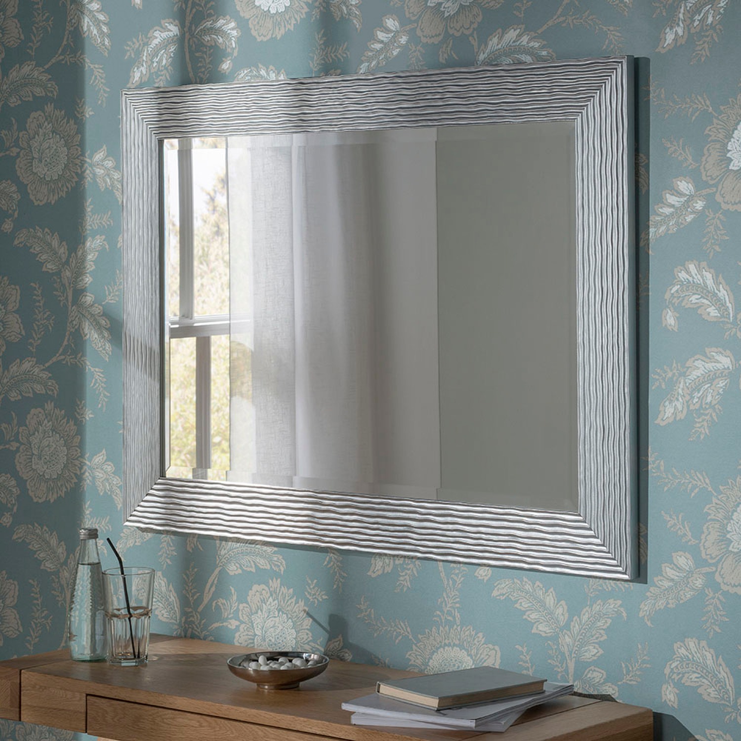 The Range Facebook ad: Mirrors that make a statement, without the designer…