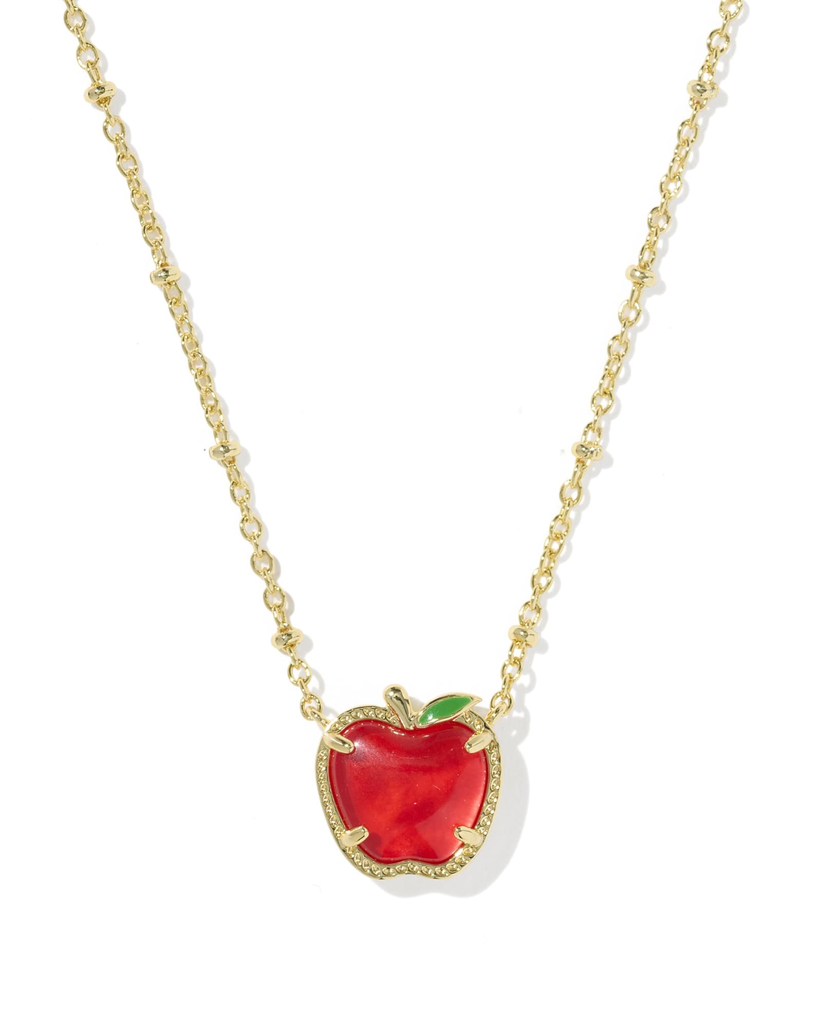Kendra Scott Facebook ad: Gold Apple Pendant Necklace With Red Illusion Stone, Short…