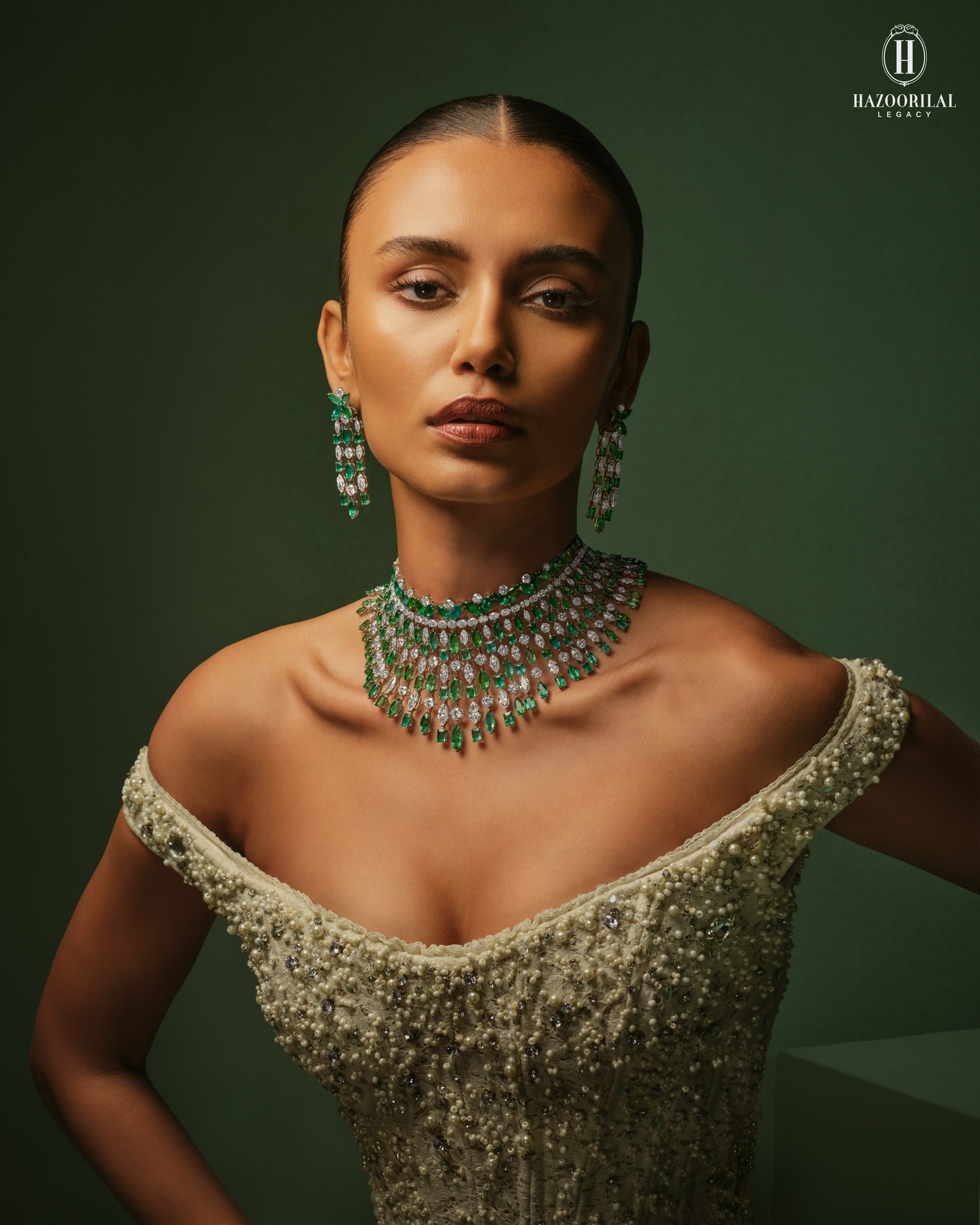 Hazoorilal Legacy Facebook ad: Layers of fancy-cut diamonds and luminous Emeralds come…