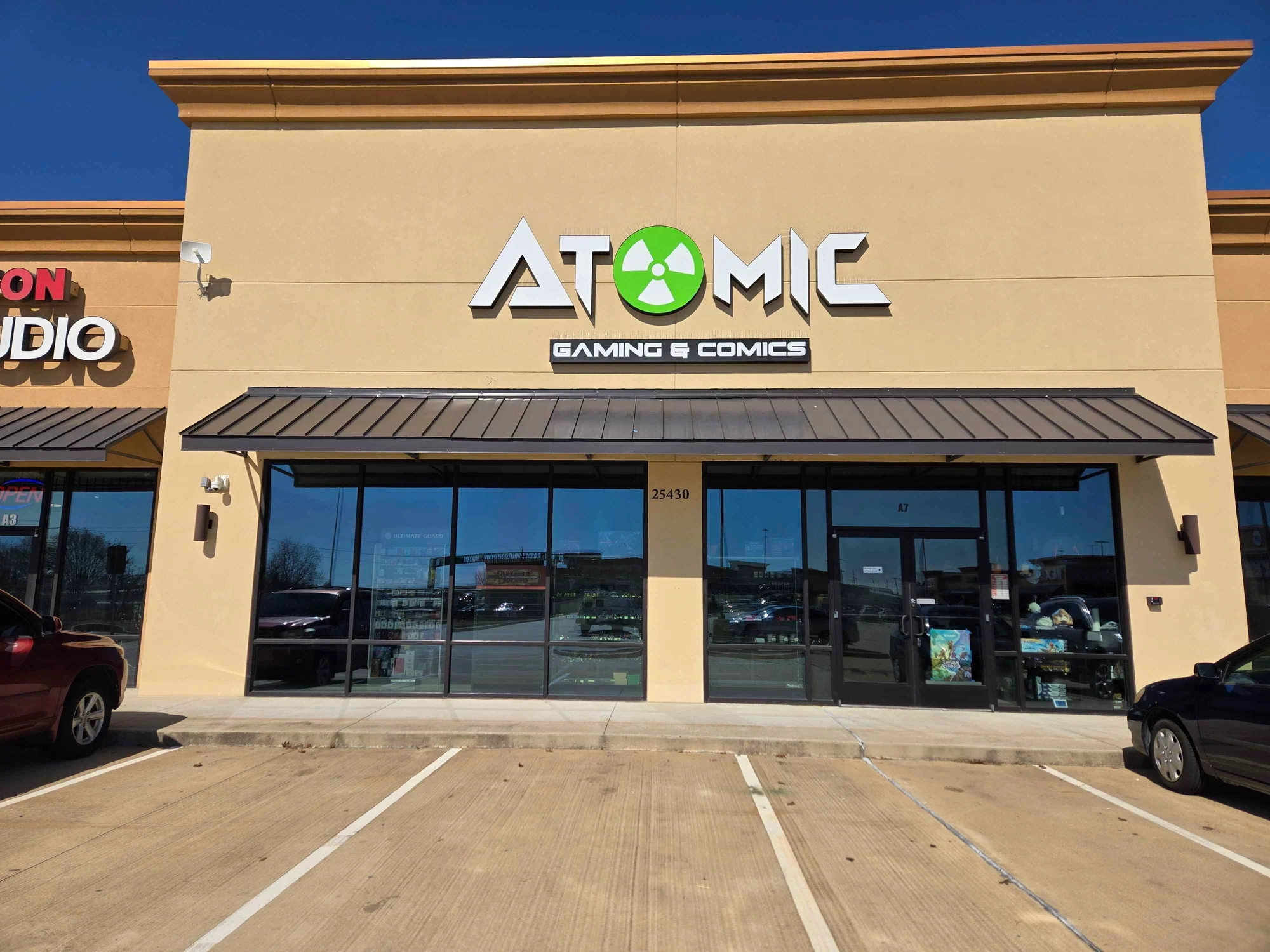 Atomic Gaming & Comics Missouri City Facebook ad: Whether you play Magic, Pokémon, tabletop games, miniatures…
