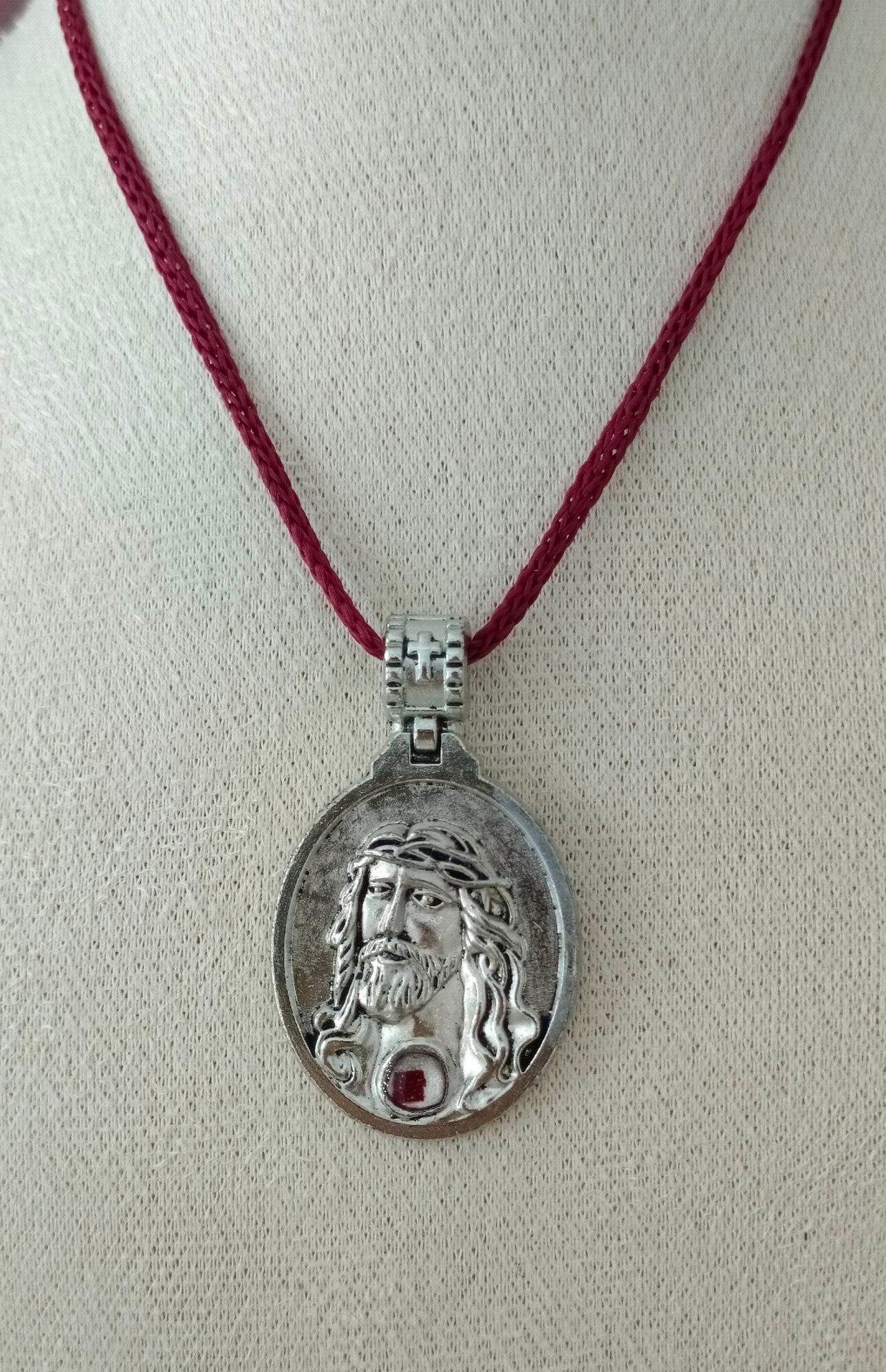 Lazada Facebook ad: OFFICIAL NAZARENO MEDALYON NG QUIAPO CHURCH | PENDANT…
