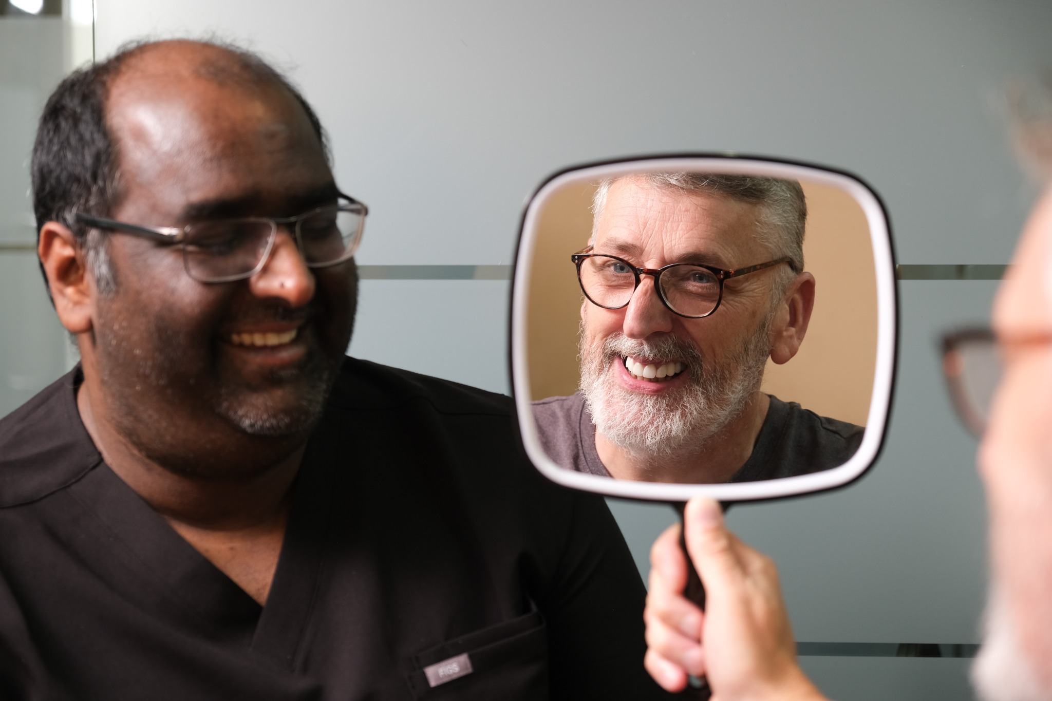 Ollie & Darsh Facebook ad: FREE Dental Implant Consultation