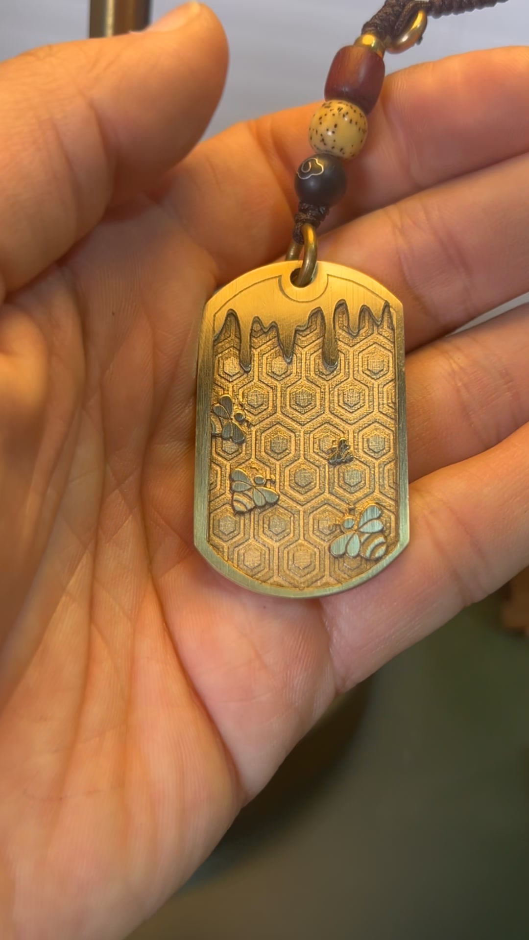 Gweike Cloud USA Facebook ad: Deep Engraving on Brass, Little Bee Pendant