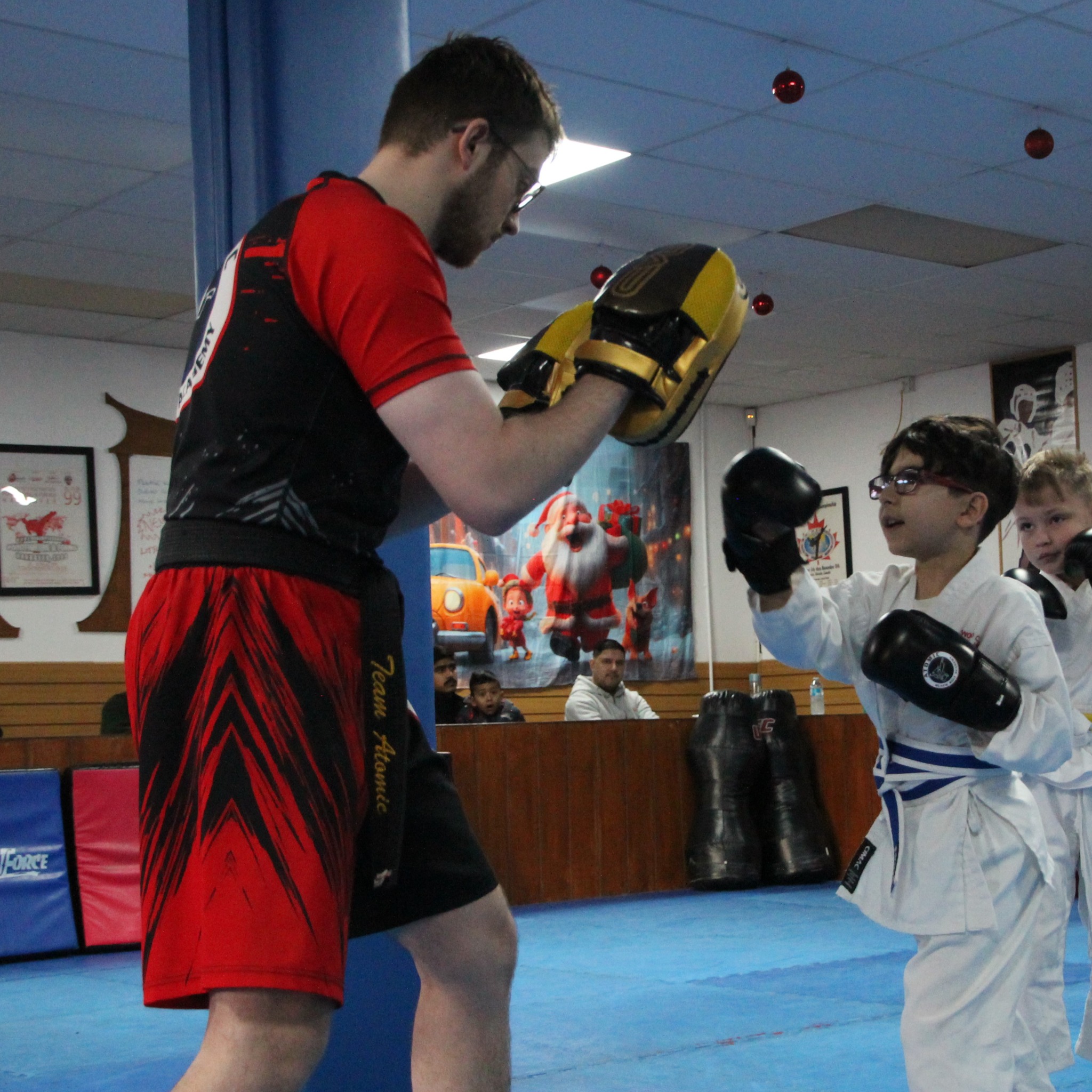 Atomic Black Belt Academy Facebook ad from Mar 24, 2026