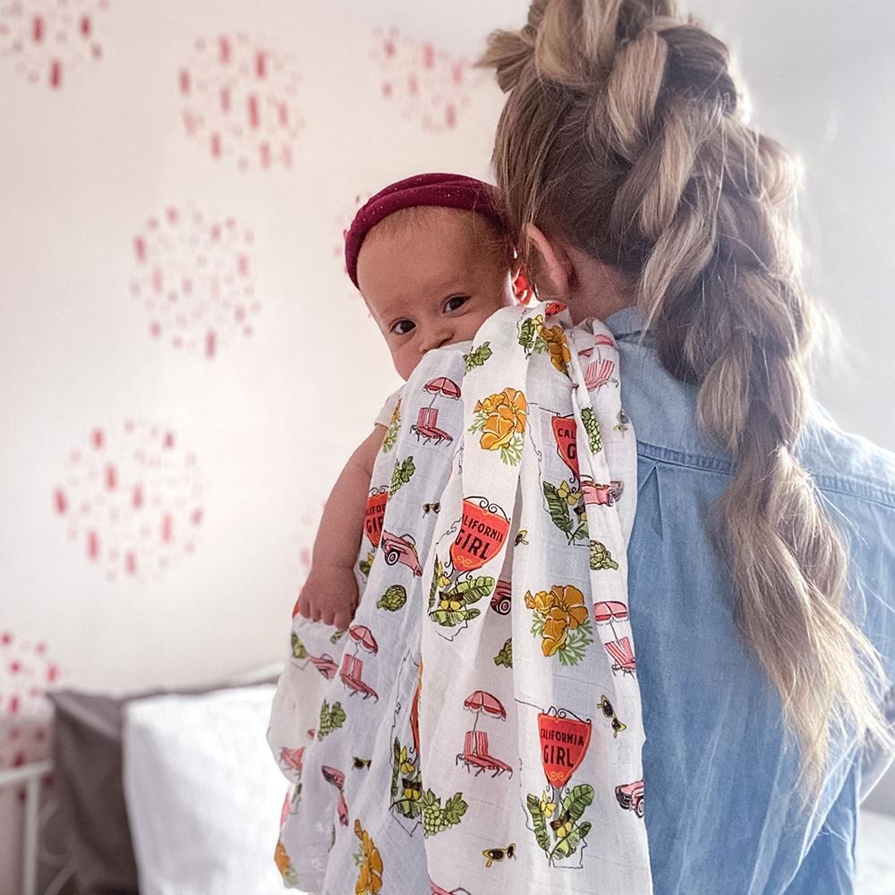 Little Hometown Facebook ad: California-Themed Baby Gift Sets: Swaddles, Bibs & Pajamas…