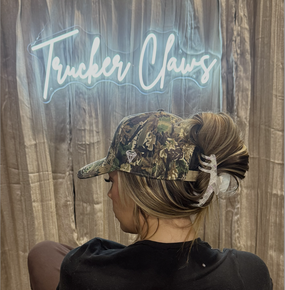 truckerclaws Facebook ad: made for hair. built for hats.