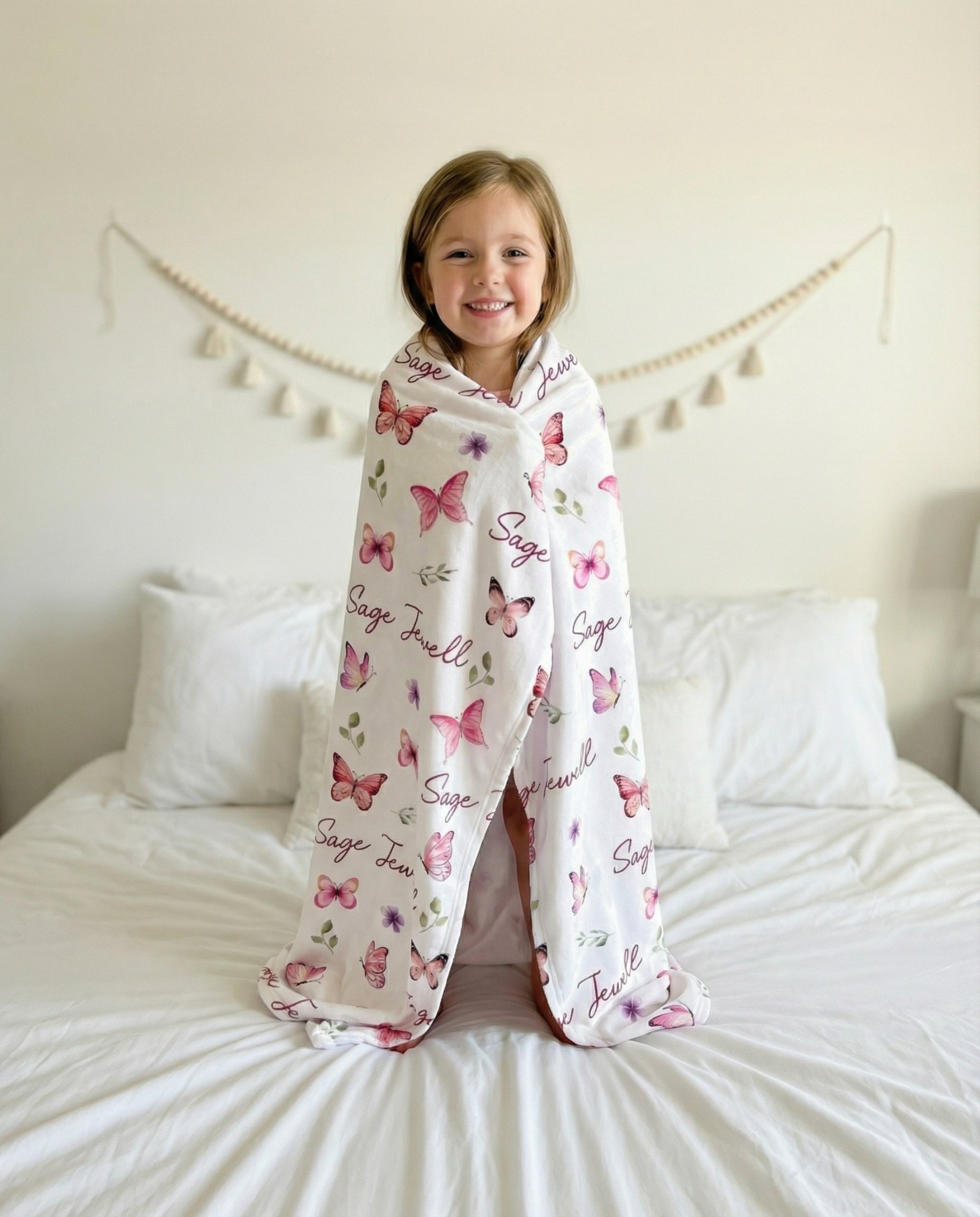 Prettybirds Facebook ad: Her Name + Pink Butterflies = The Blanket That Becomes…