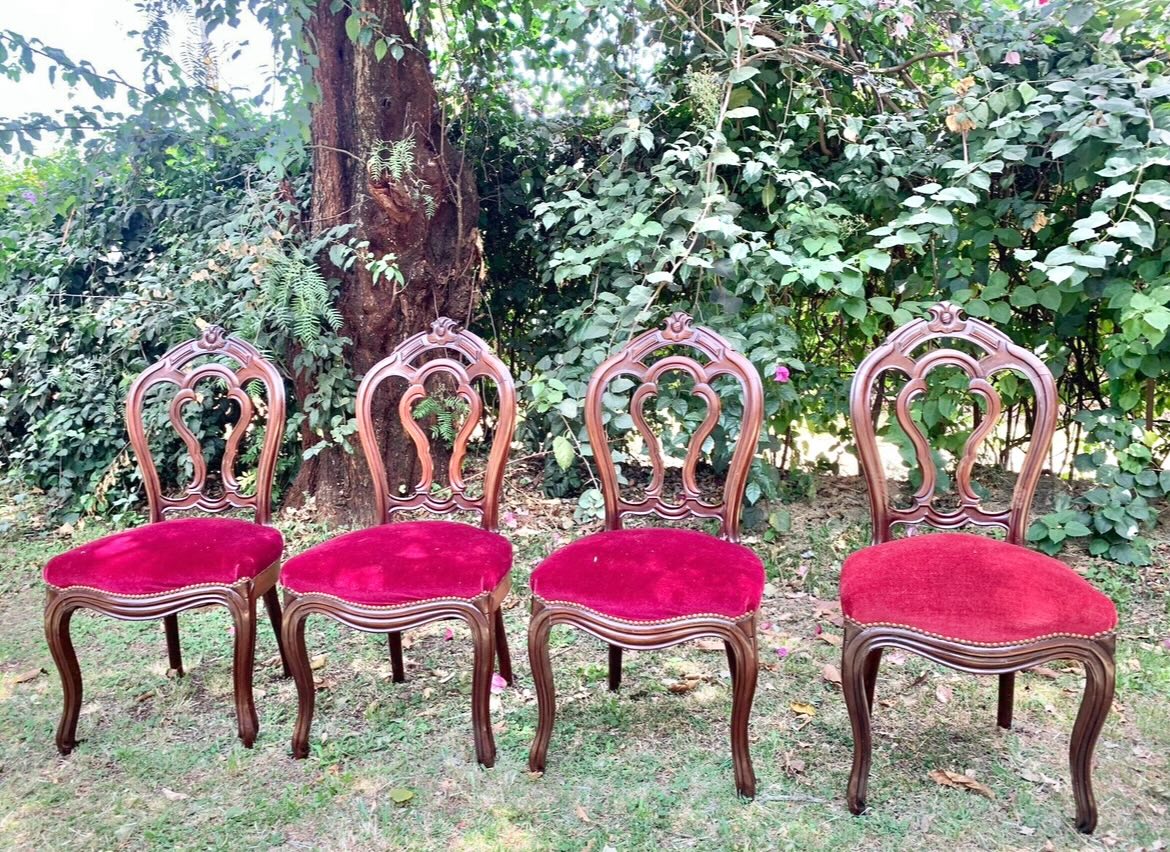 The Rustic Bench Facebook ad: A set of four vintage velvet dining chairs.