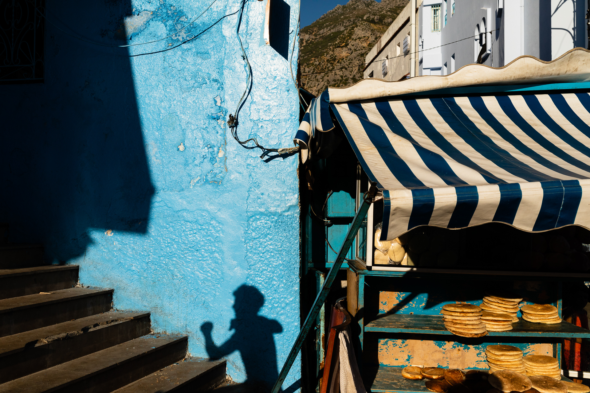 Canon Central & North Africa Facebook ad: Blue walls, striped awnings, and warm bread waiting…