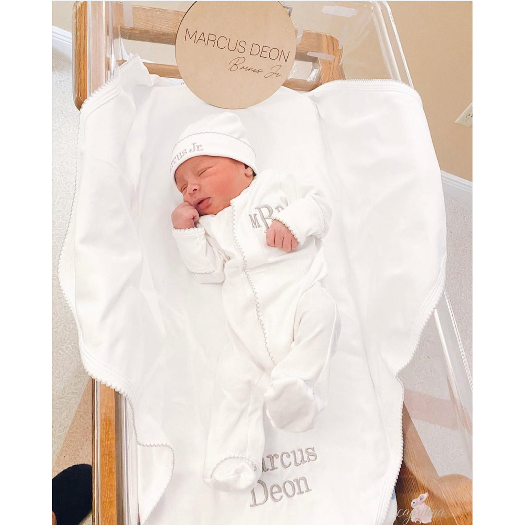 Caprilina Facebook ad: Celebrate their arrival with custom newborn essentials made…