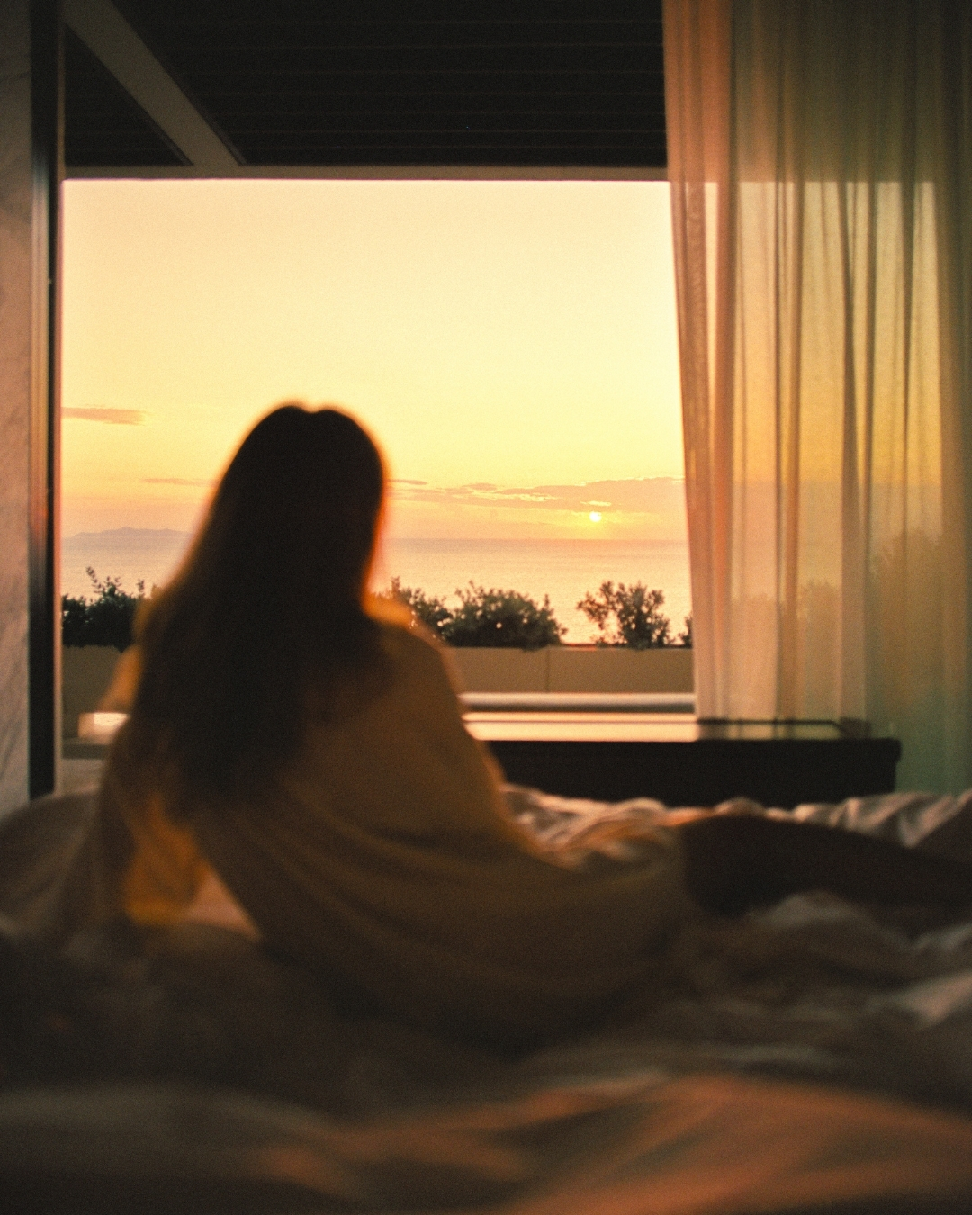 One&Only Kéa Island Facebook ad: Golden light lingers across the horizon as the…