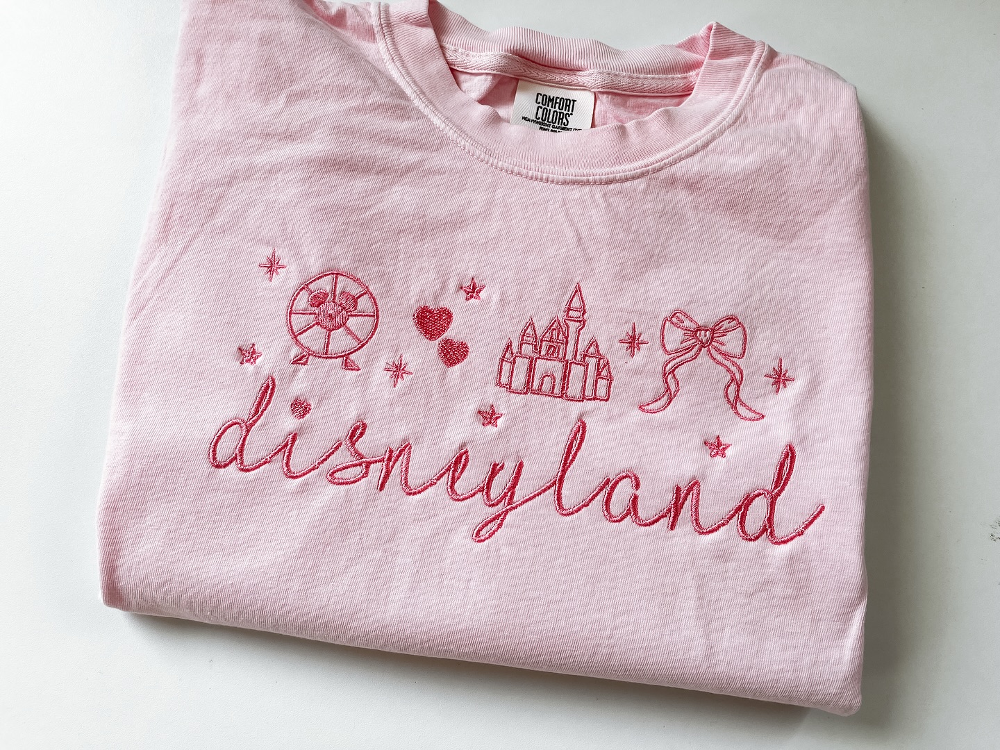 Jolly Holiday Embroidery Facebook ad: Disneyland coquette style