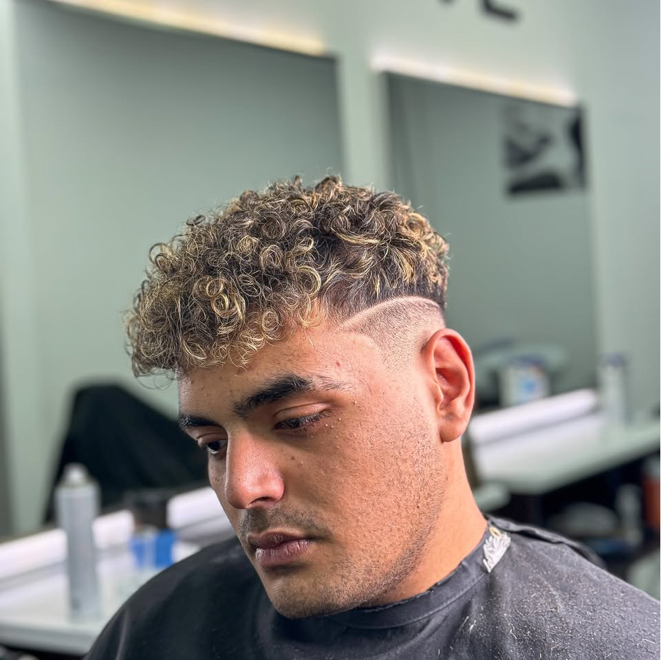 Exposure Men Studio Facebook ad: Men’s barber shop offering a range of traditional…
