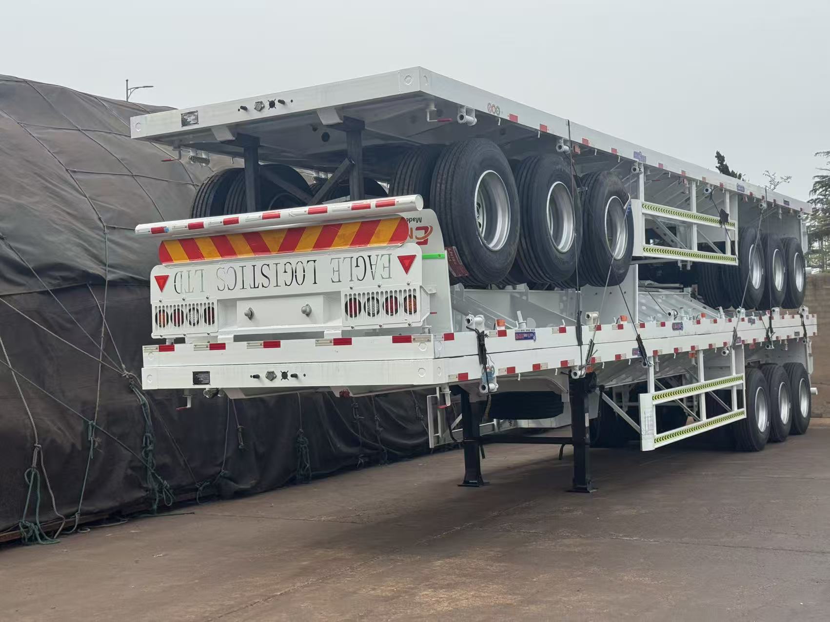 Shandong Enxin Automobile Trading Co., Ltd Facebook ad: HEAVY-DUTY FLATBED TRAILER, DIRECT FROM FACTORY!