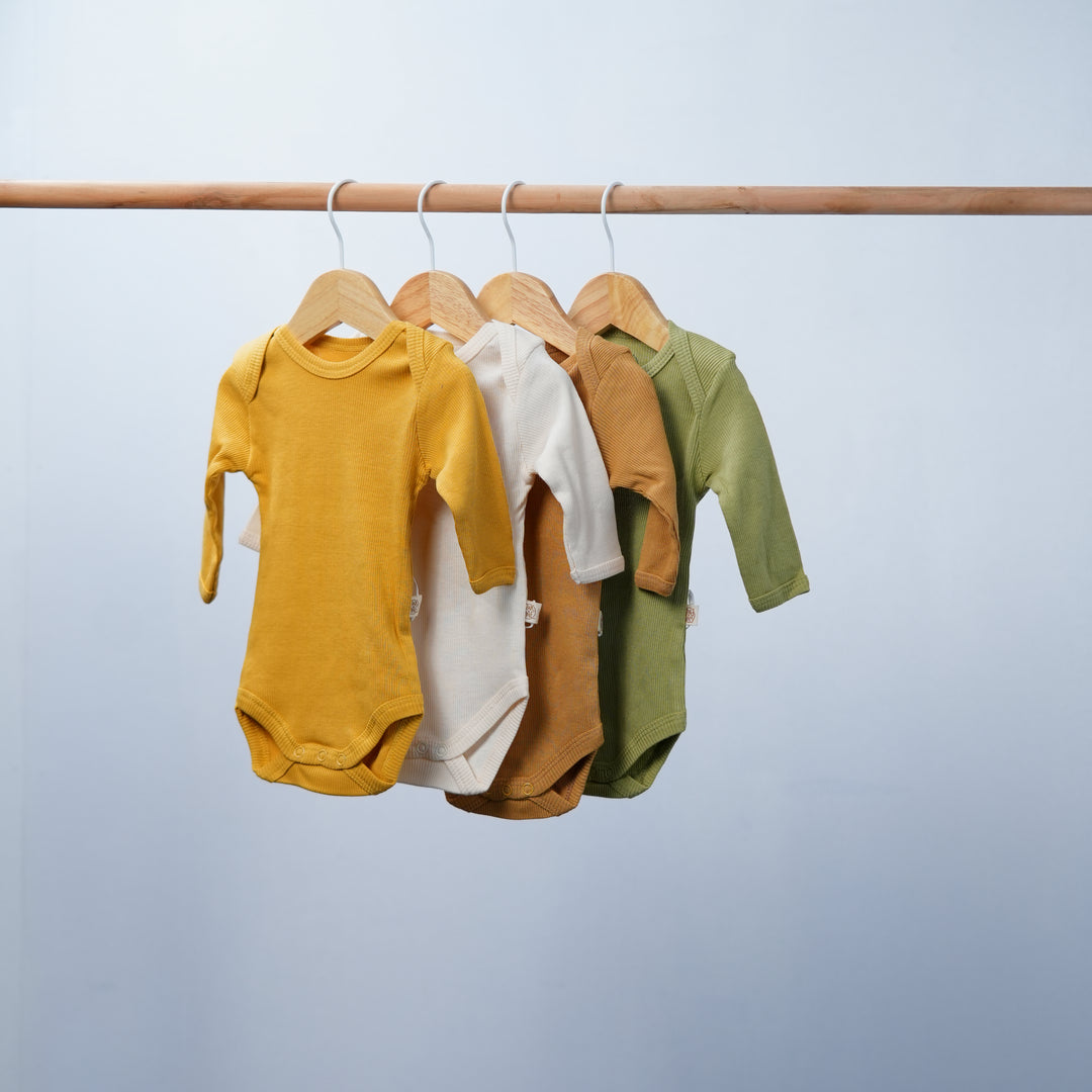 Essentials For Tots Facebook ad: Organic Baby Clothes do not need marketing!