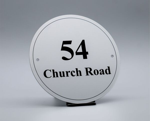 Brunel Engraving Company Facebook ad: Handcrafted house signs made with quality materials.