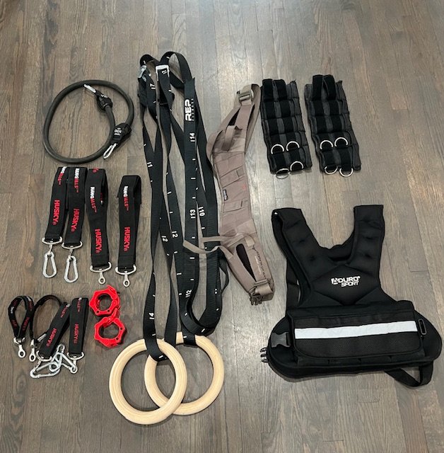 Michele Lewis Facebook ad: Home Gym Bundle - Rings, Weighted Vest, Bands + More