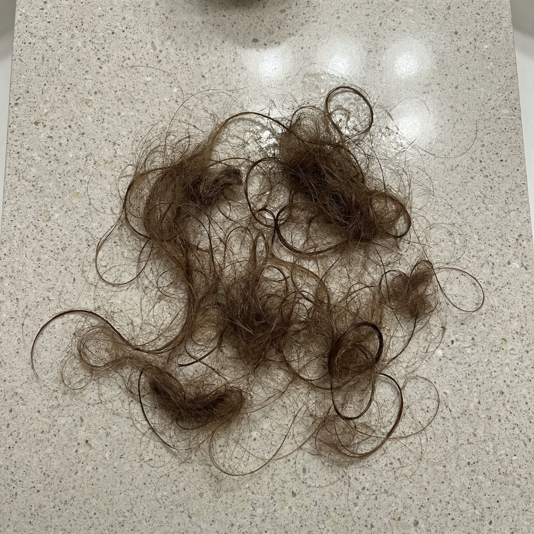 Slimova Facebook ad: Have you noticed more hair on your brush or in the drain…