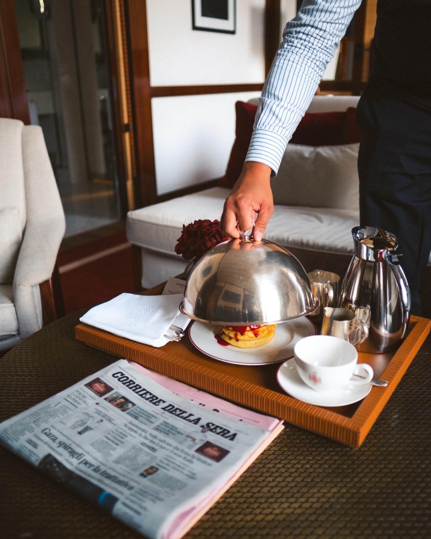 Portrait Milano Facebook ad: Room service, fresh coffee, and newspapers to flip.