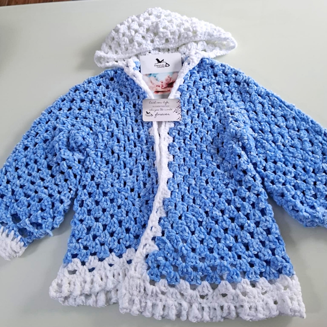 Every Life Counts Facebook ad: Every stitch made with love.