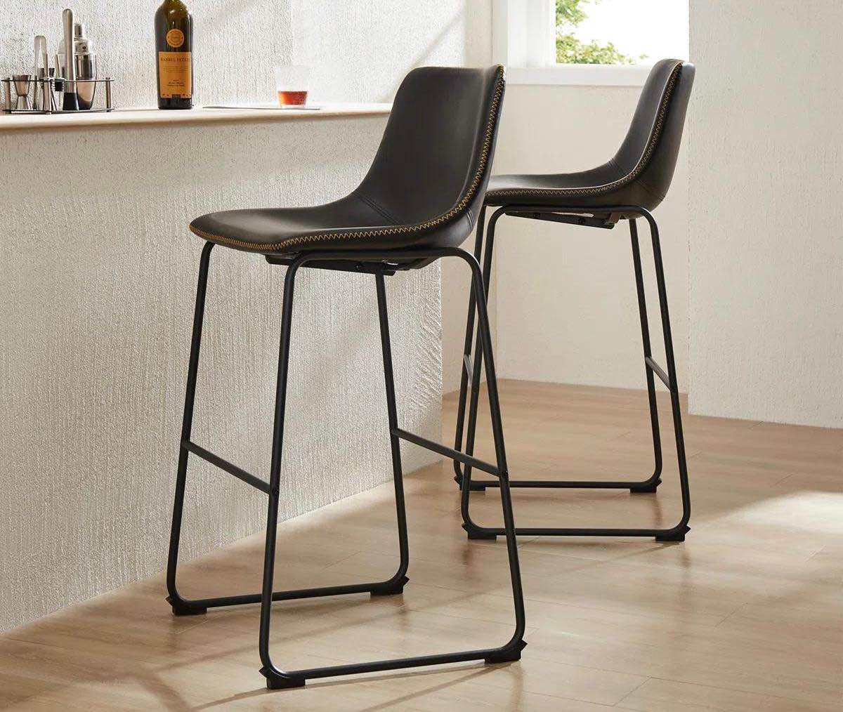 Ismo Markt Facebook ad: $100 SET OF 2 (BRAND NEW) Mid-Century Black Leather…