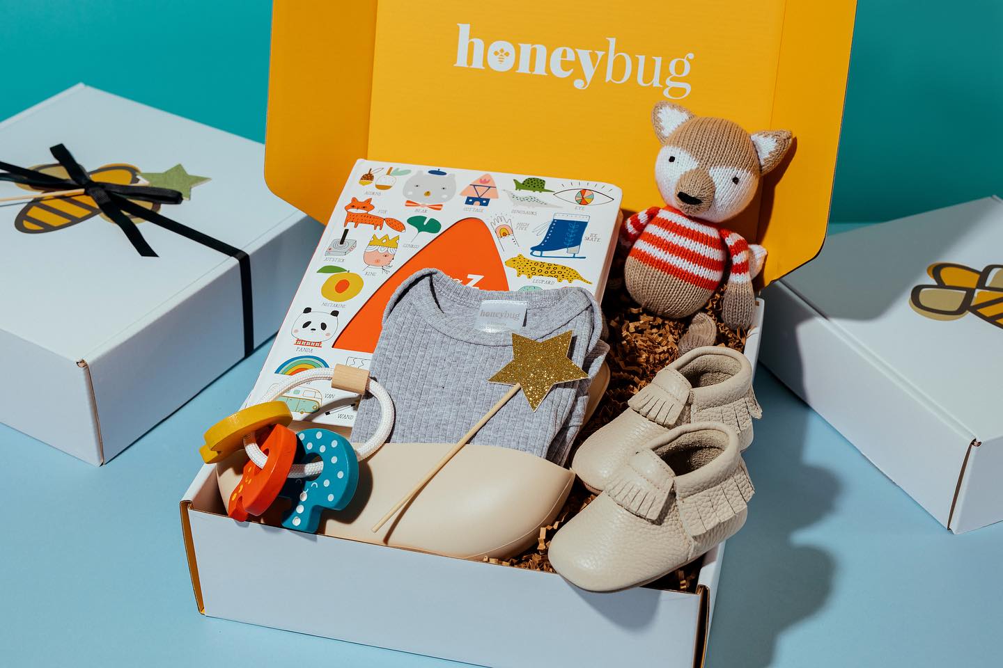 HoneyBug Facebook ad: HoneyBug specializes in unique baby clothes, toys, gifts…