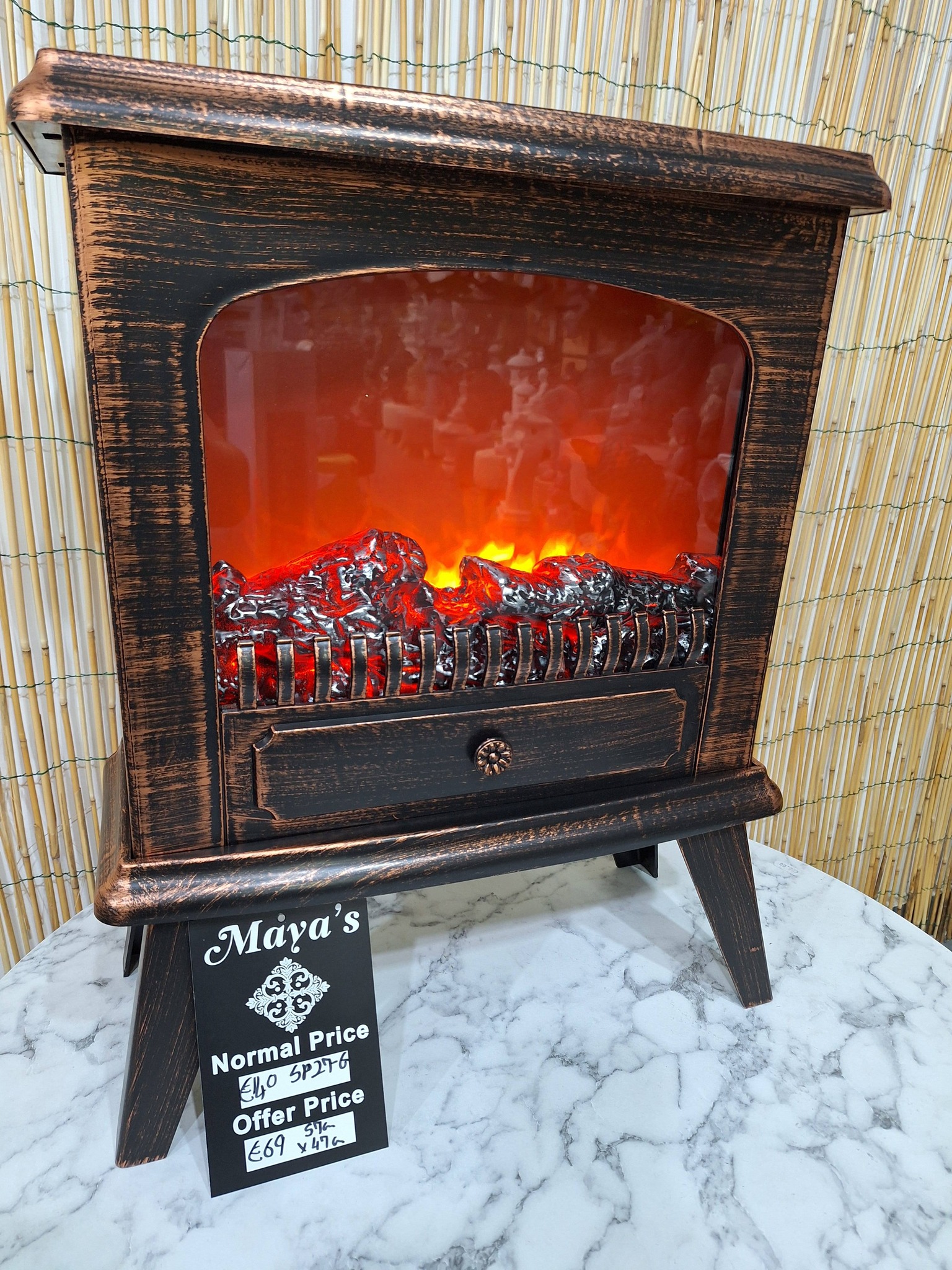 Maya's modern art Facebook ad: Artificial fireplaces 50% off