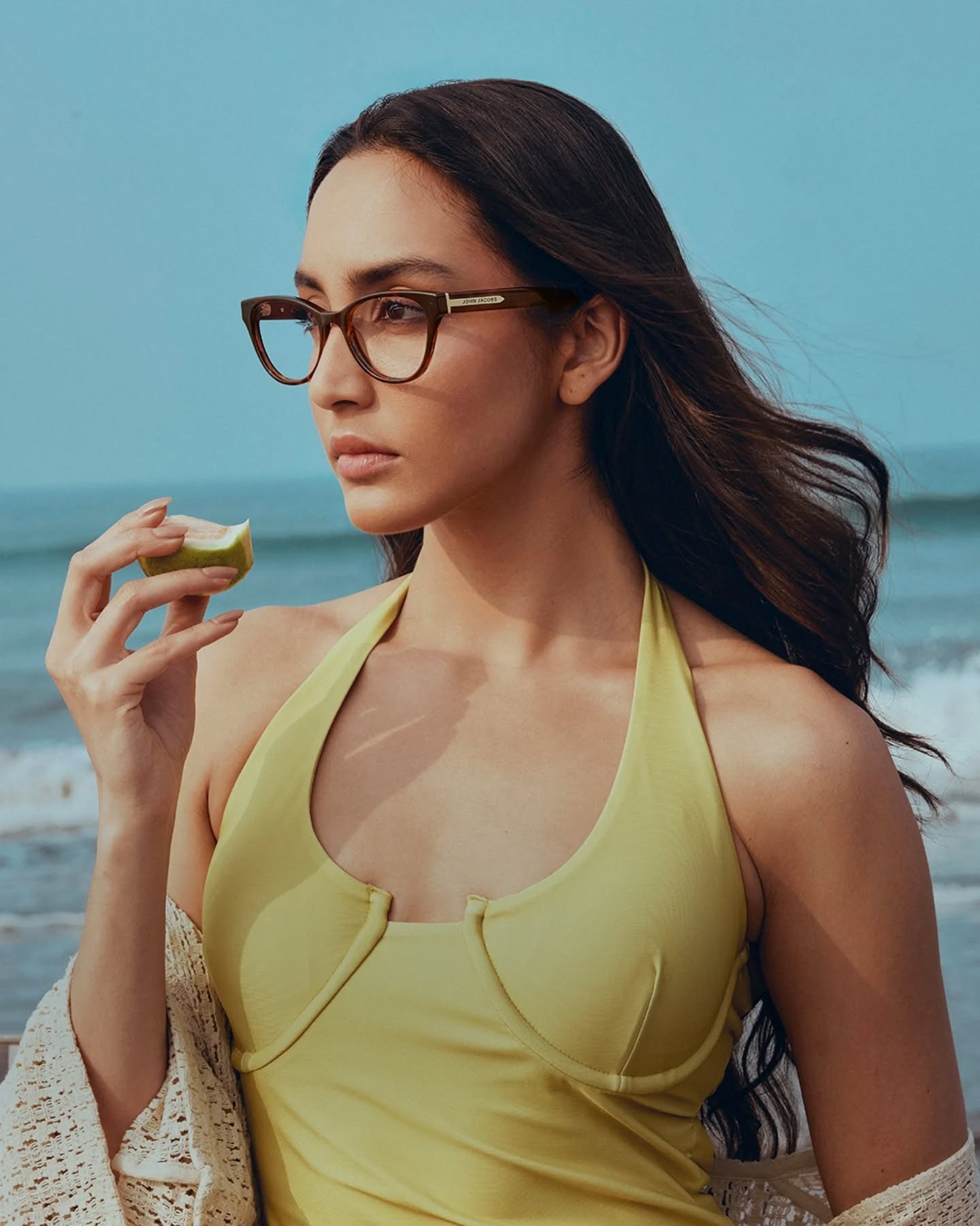 John Jacobs Eyewear Facebook ad: Sun on your skin, salt in the air…