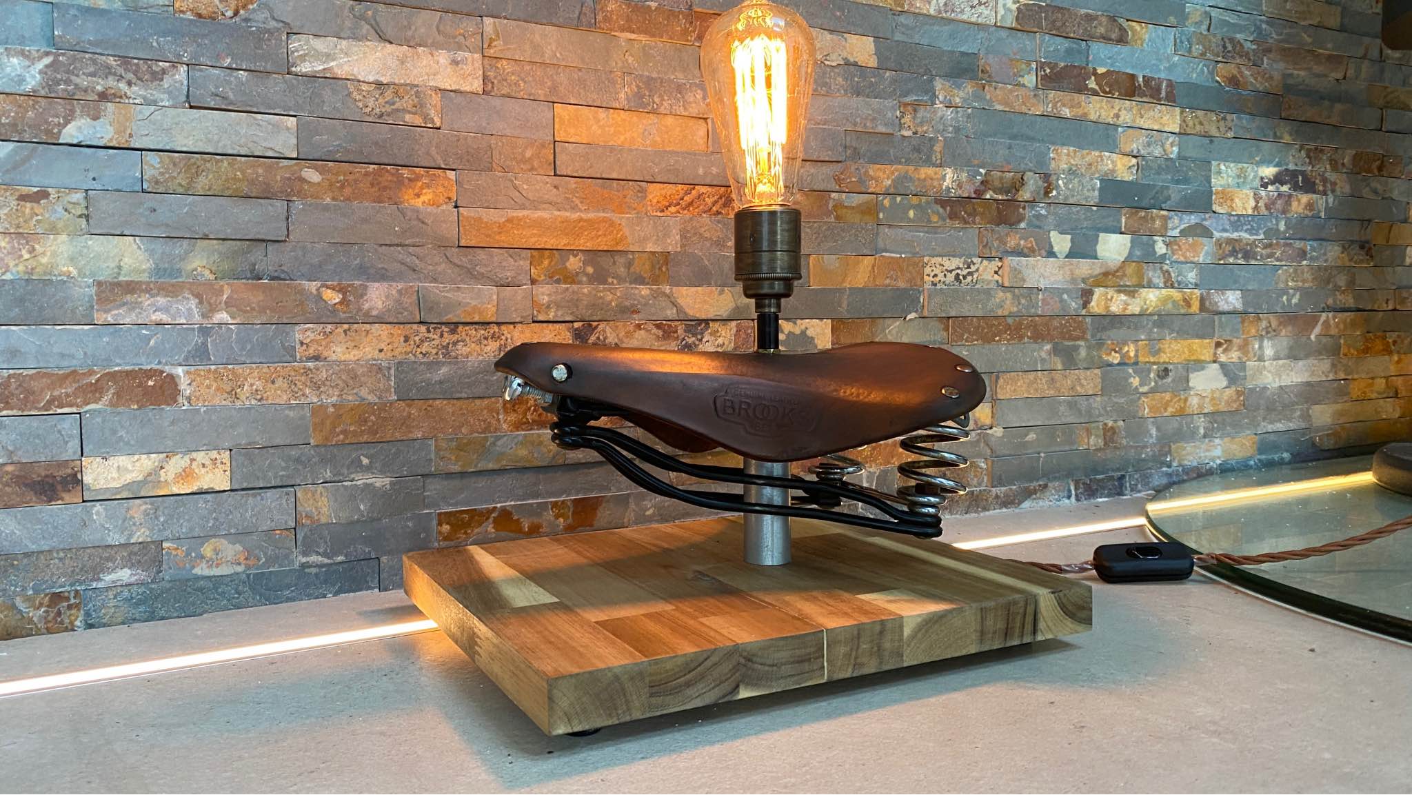 Pete Heydon Facebook ad: Vintage Brooks leather saddle up cycled unique lamp
