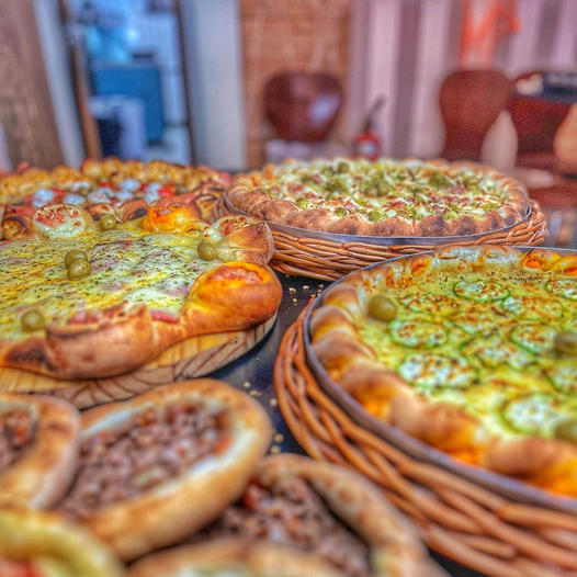 Pizzaria & Esfiharia "No Lugar de Sempre" Facebook ad