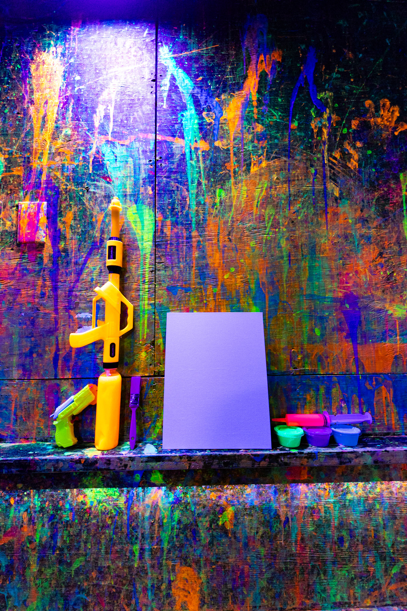 AxGard Facebook ad: Step into Towson’s glow-in-the-dark splatter paint room and…