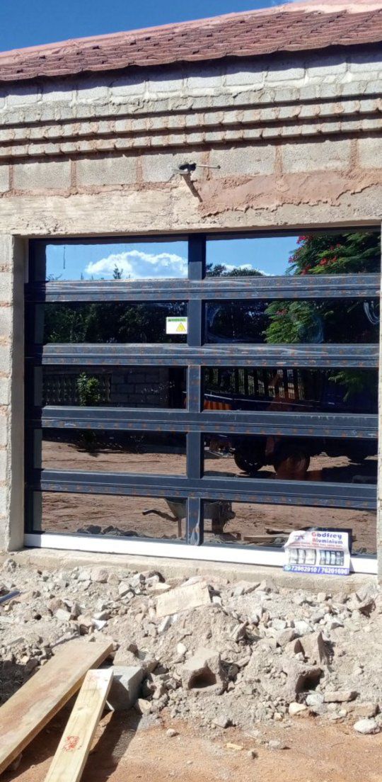 Godfrey Aluminium Windows & Doors Facebook ad: Contact us on all your Aluminium Windows &…